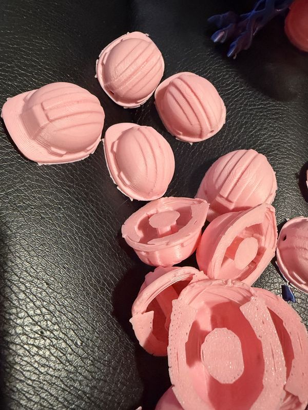 Pink 3D-printed miniature hard hat charms